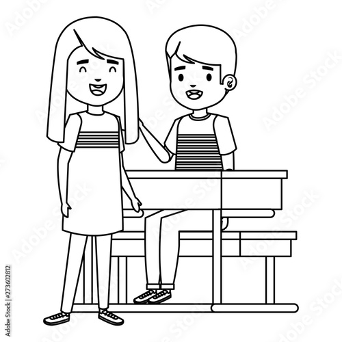 cute little students couple in school desk