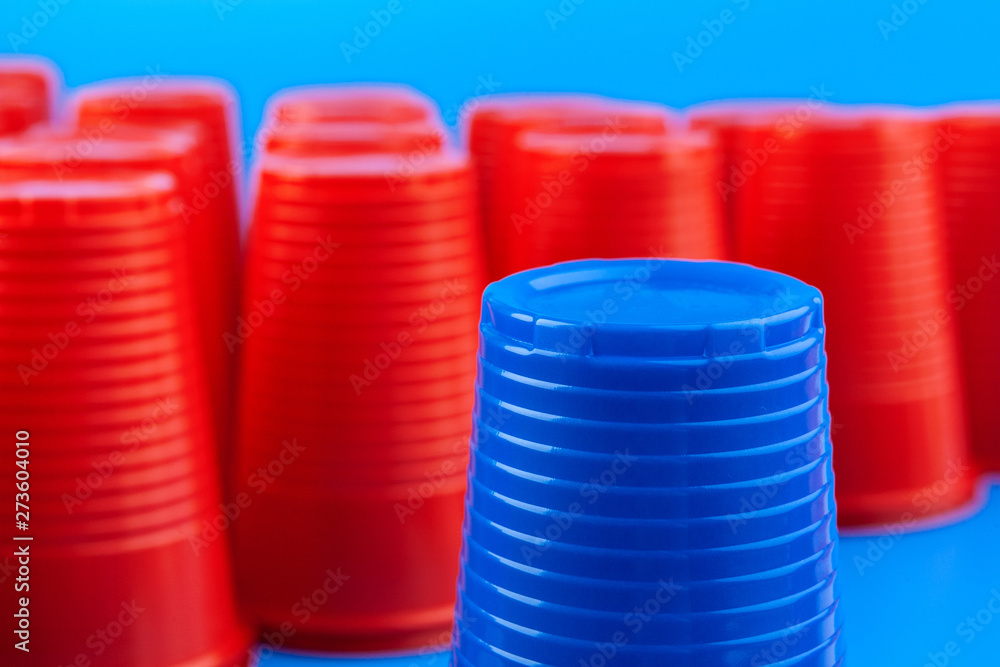 Beer pong, college party game. Plastic red and blue color cups Beer pong, college party game. Plastic red and blue color cups
