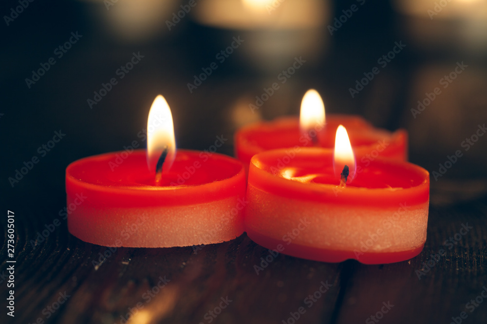candles burning in darkness over black background. commemoration concept. candles burning in darkness over black background. commemoration concept.