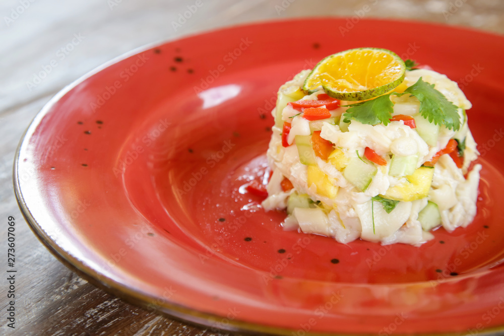 Vegetarian mushroom ceviche served on a red ceramic plate, fine casual dining concept Vegetarian mushroom ceviche served on a red ceramic plate, fine casual dining concept
