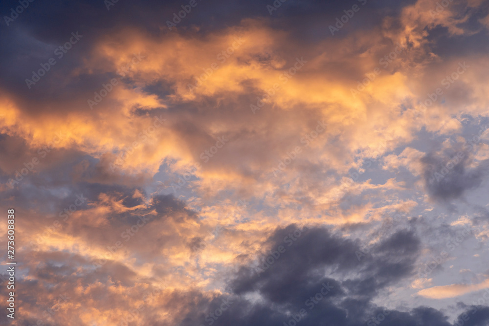 beautiful evening sky with golden clouds as a natural background