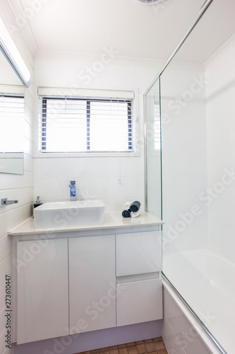 Bathroom with a Window  Tub and Basin