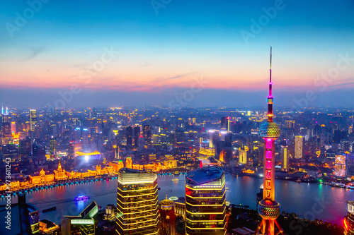 Aerial cityscape of Shanghai at sunset. Panoramic view of Pudong business district skyline from the skyscraper