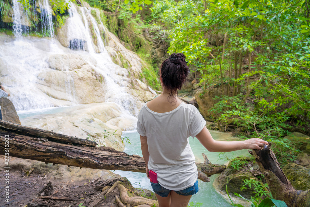 Young girl traveling at beautiful Erawan waterfall National Park Kanchanaburi, Thaialnd Young girl traveling at beautiful Erawan waterfall National Park Kanchanaburi, Thaialnd