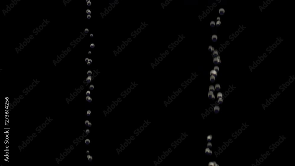 Transparent bubbles go up underwater over black background Transparent bubbles go up underwater over black background