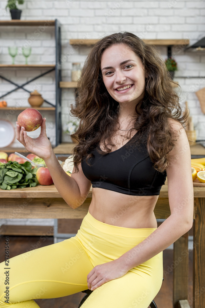 Fototapeta premium Brunette woman in the kitchen