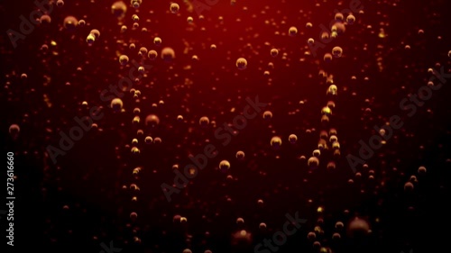 Transparent bubbles go up underwater over coca-cola background