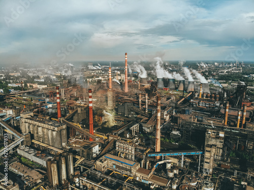 Aerial view of Factory or Plant Industrial Area with many pipes or chimneys with smoke. Heavy industry of Metallurgical Production industry landscape