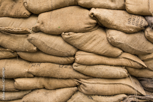 A pile of rough canvas bags in the background