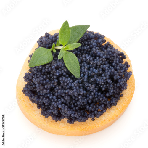 Canapes with black sturgeon caviar and  spice isolated on the white background.