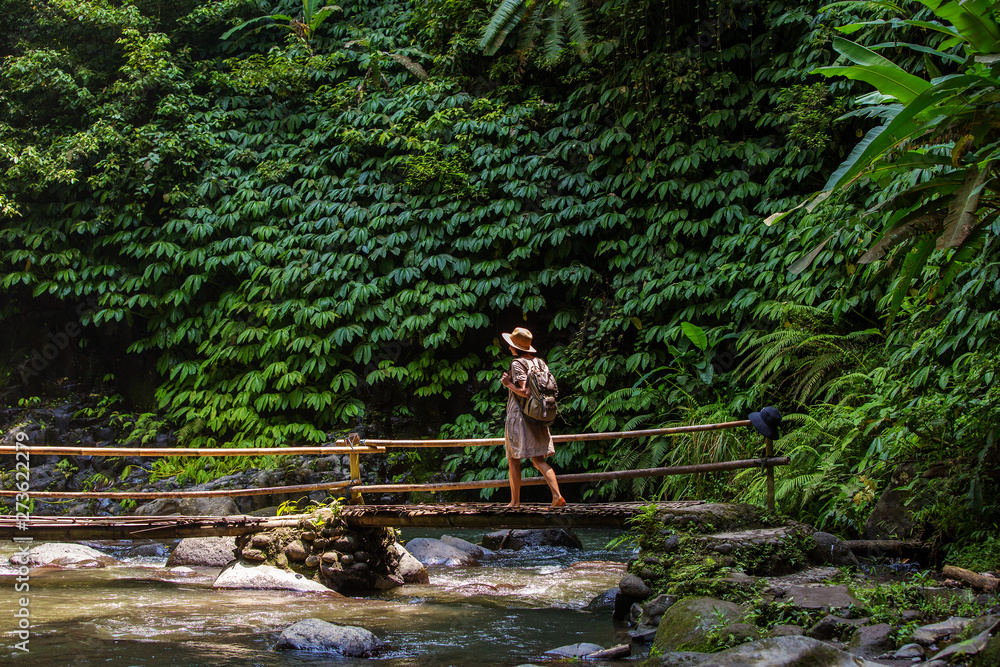 Woman near Nung Nung waterfal on Bali, Indonesia