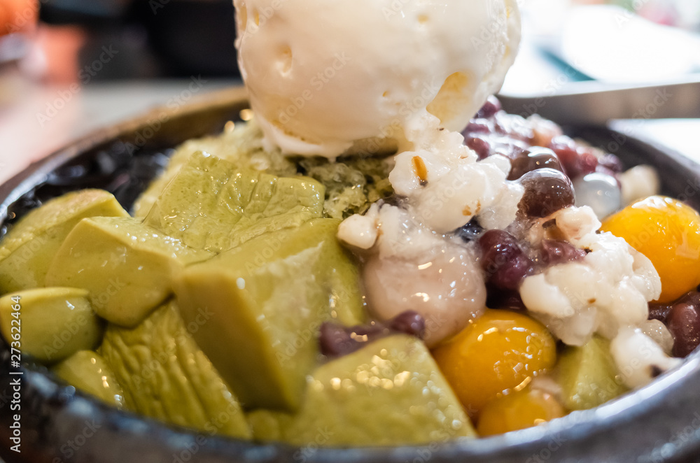 eating shaved ice with colorful dessert eating shaved ice with colorful dessert