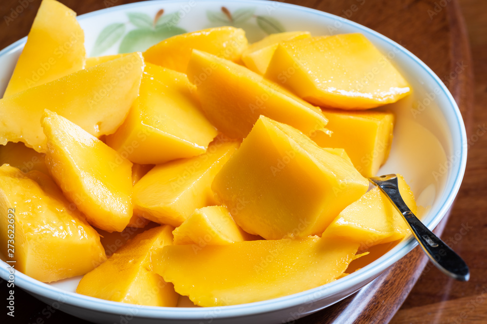yellow mango on a dish yellow mango on a dish