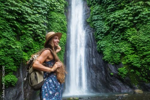 Woman near Munduk waterfal on Bali  Indonesia