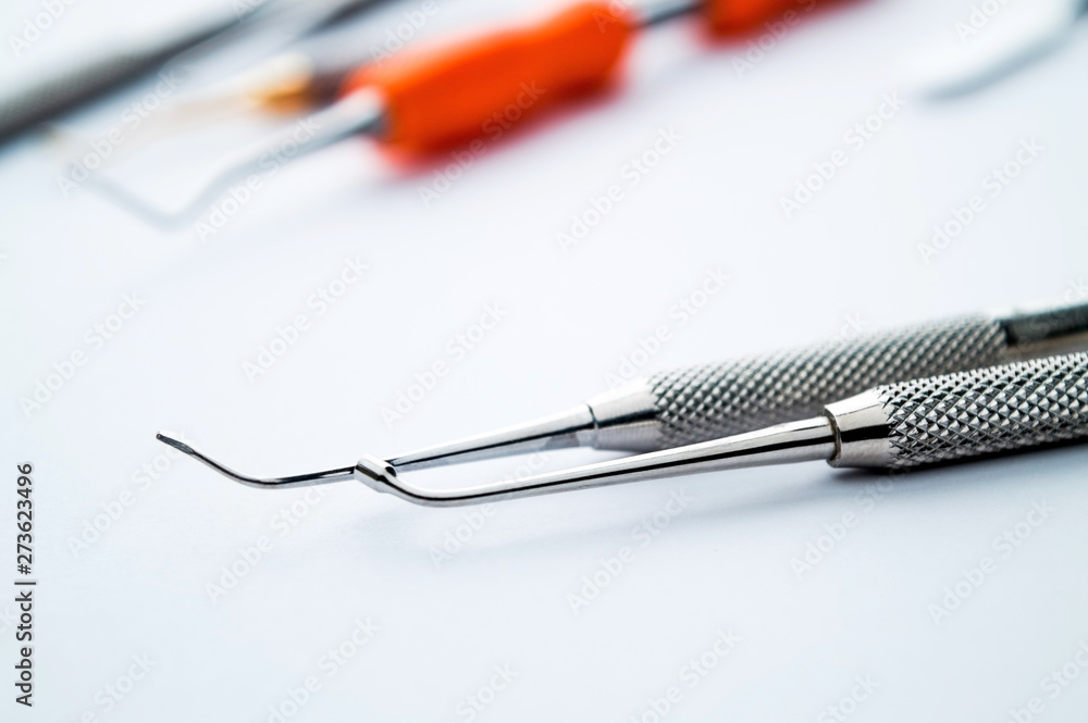 A set of metal instruments medical equipment for dental dental care. Healthy teeth concept