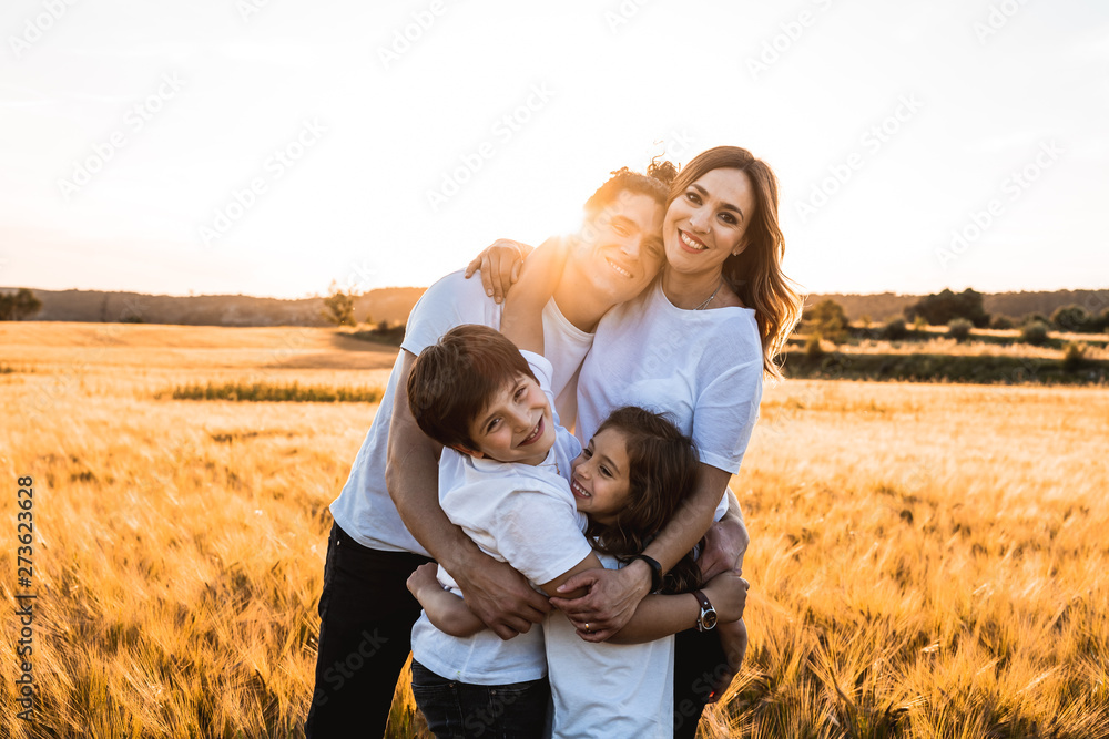 Portrait of a happy and fun family in the countryside. Concept of united family smiling