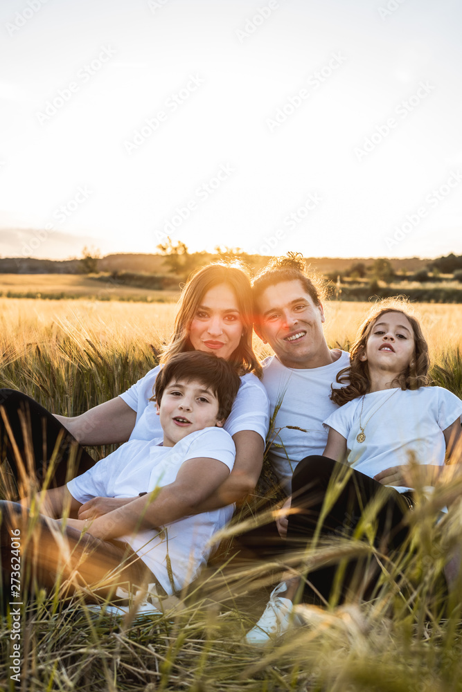 Portrait of a happy and fun family in the countryside. Concept of united family smiling