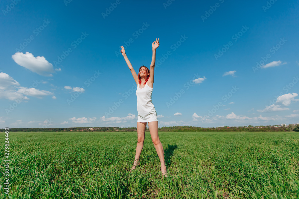 girl walking on a green field girl walking on a green field