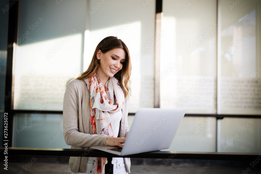 Happy girl working online or studying and learning while using tablet Happy girl working online or studying and learning while using tablet