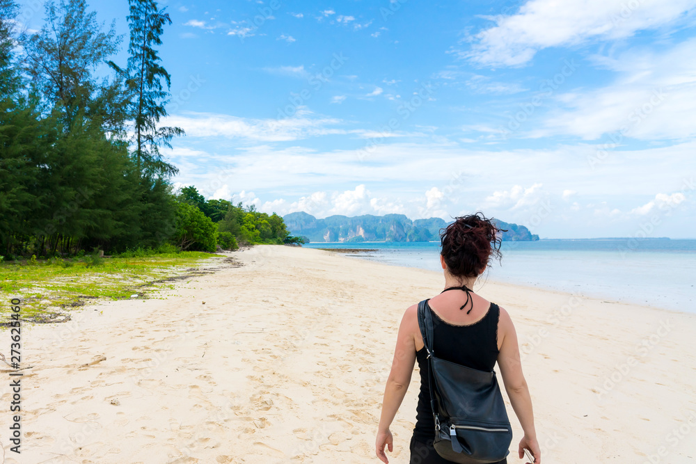Fototapeta premium Young girl woman female on Beautiful Tropical Beach PP Island, Krabi, Phuket, Thailand blue ocean backgroundWomen items vacation accessories for holiday long weekend guide choice idea for planning t