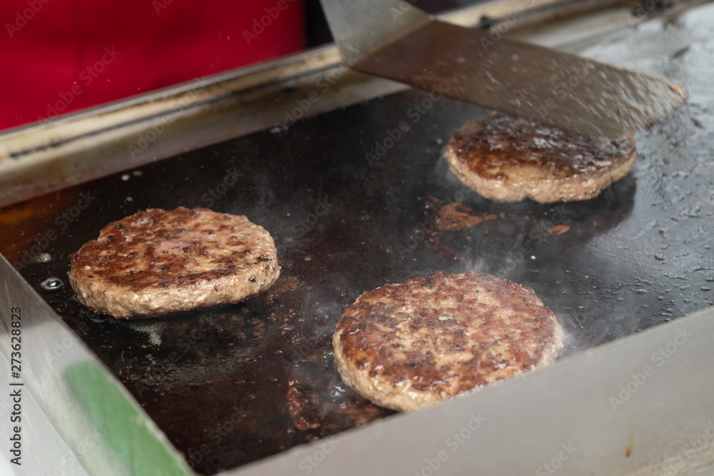 Fresh meat cutlets in a frying pan grill. Fresh meat cutlets in a frying pan grill.