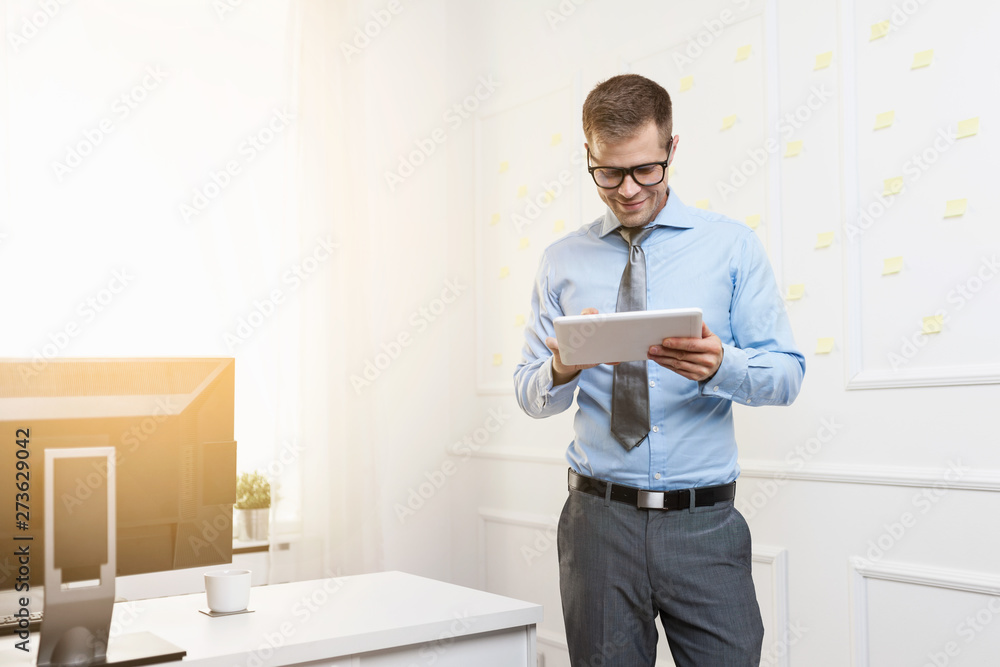 Successful businessman working in his office Successful businessman working in his office