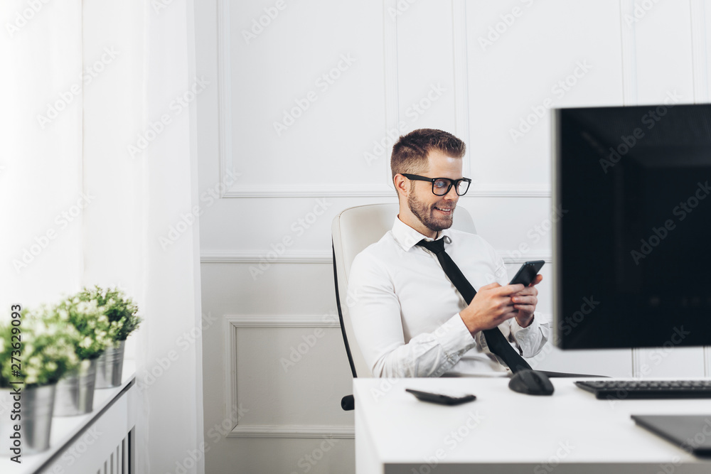 Fototapeta premium Successful businessman working in his office