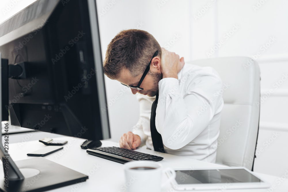 Fototapeta premium Office worker with pain from sitting at desk all day