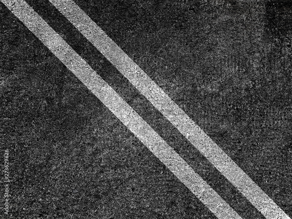 Fototapeta premium Double white lines on asphalt road background.