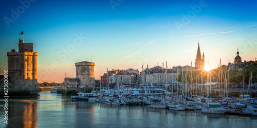 Panorama of the old harbor of La Rochelle, France at sunset photo