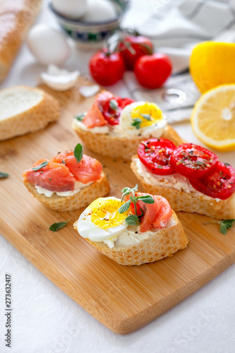 Toasted Bread With Mozzarella, Eggs And Tomatoes