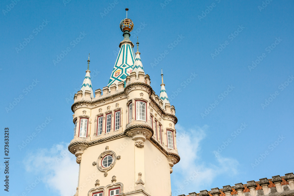Wonderful view of the ancient tower of the city hall in Sintra in Portugal against the blue sky.