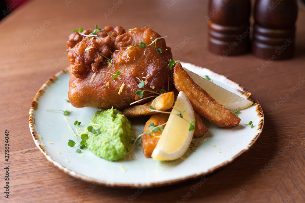 Battered fish with fried potatoes Battered fish with fried potatoes