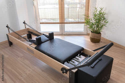 Pilates studio room with reformer beds photo