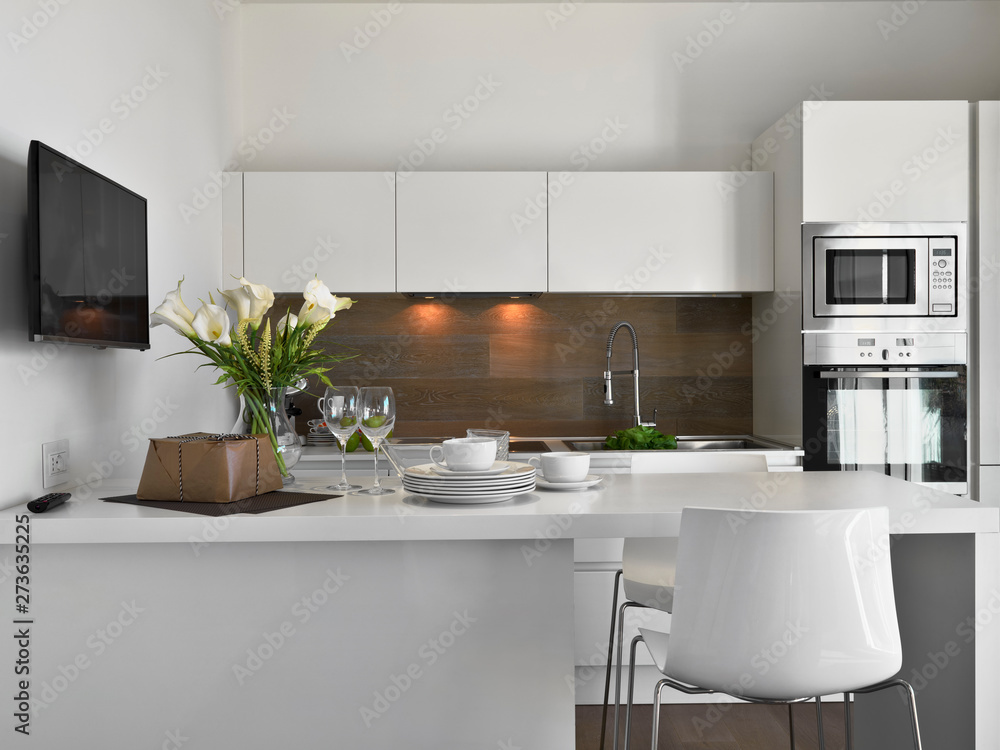 interior shots of a modern white kitchen and kitchen island Stock Photo ...