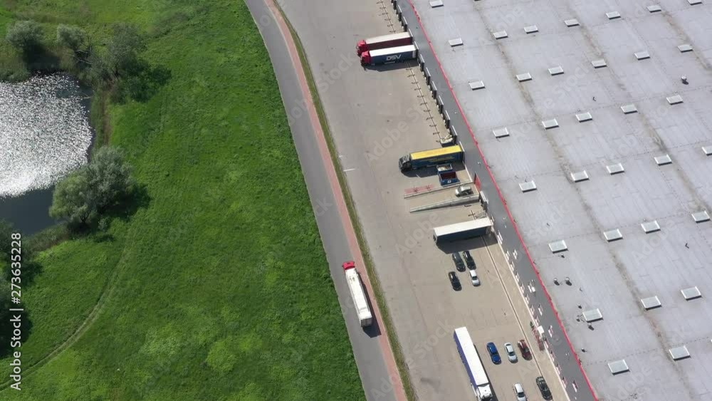 Aerial Shot of Truck with Attached Semi Trailer Leaving Warehouse complex - Aerial Shot of Truck with Attached Semi Trailer Leaving Warehouse complex -
