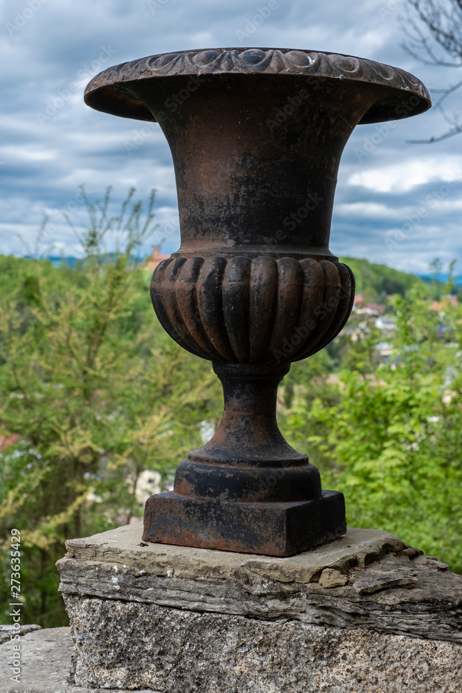 Old vase near the ancient castle Old vase near the ancient castle