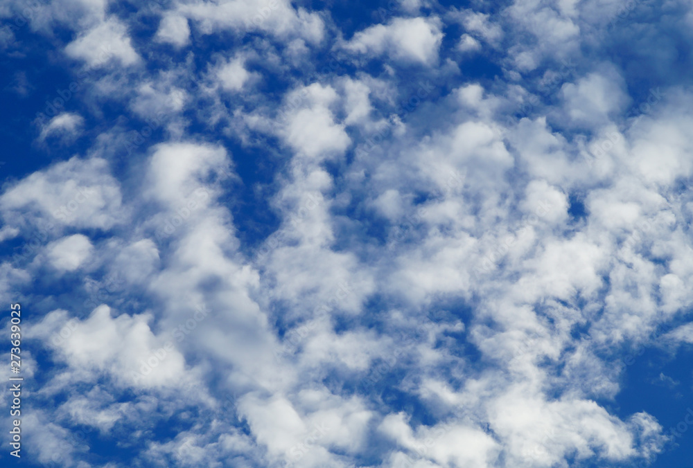 Blue sky with cumulus clouds in bright sunny summer weather. Blue sky with cumulus clouds in bright sunny summer weather.