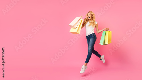 Big Sales. Girl Running With Shopping Bags