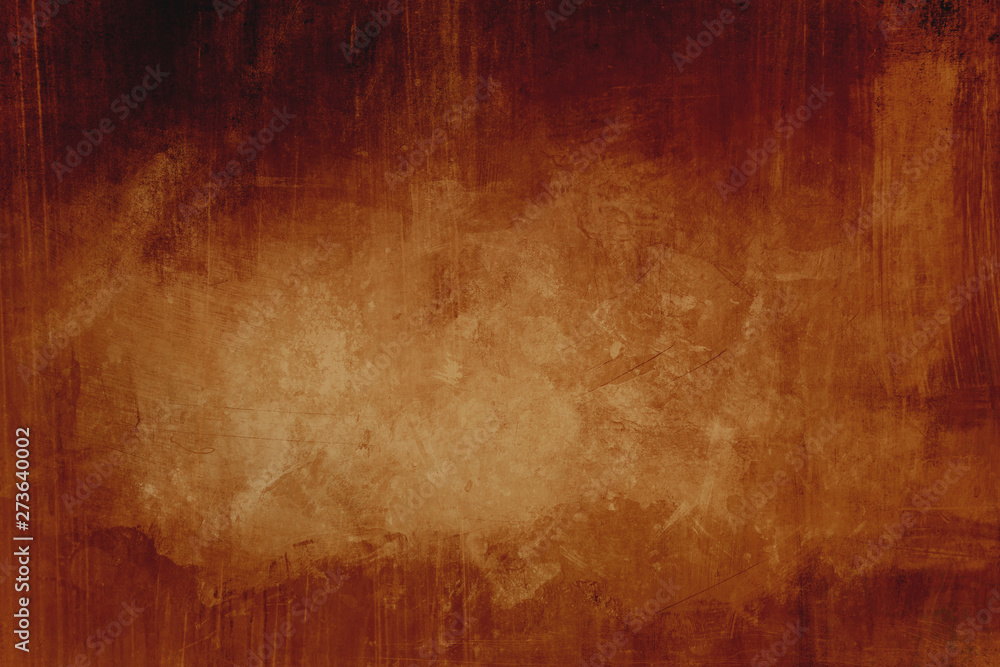 Dark orange grungy background with spotlight background