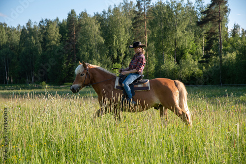 Woman horseback riding