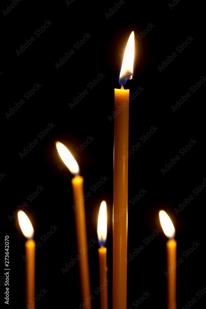 burning in the dark taper candles. the fire burning in the darkness. burning in the dark taper candles. the fire burning in the darkness.