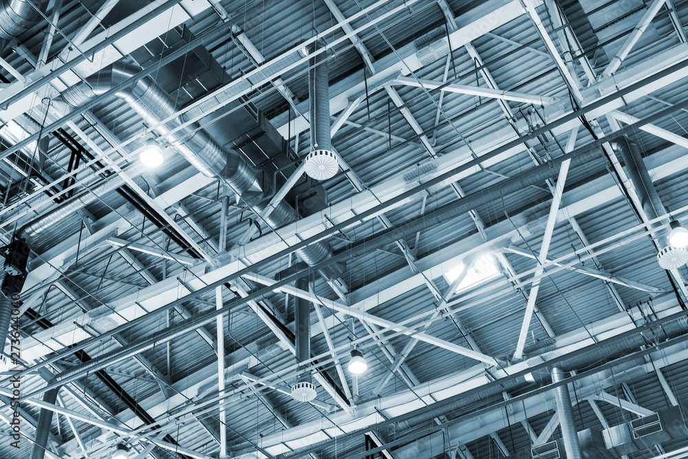 metal roof of the building with a complex system of ventilation, fire extinguishing and burglar alarm. Toned image metal roof of the building with a complex system of ventilation, fire extinguishing and burglar alarm. Toned image