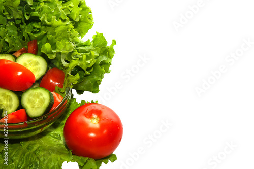 Close-up of colorful organic vegetables on white background.