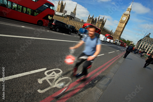 Photography Fast moving London bicycle commuter crossing Westminster Bridge.