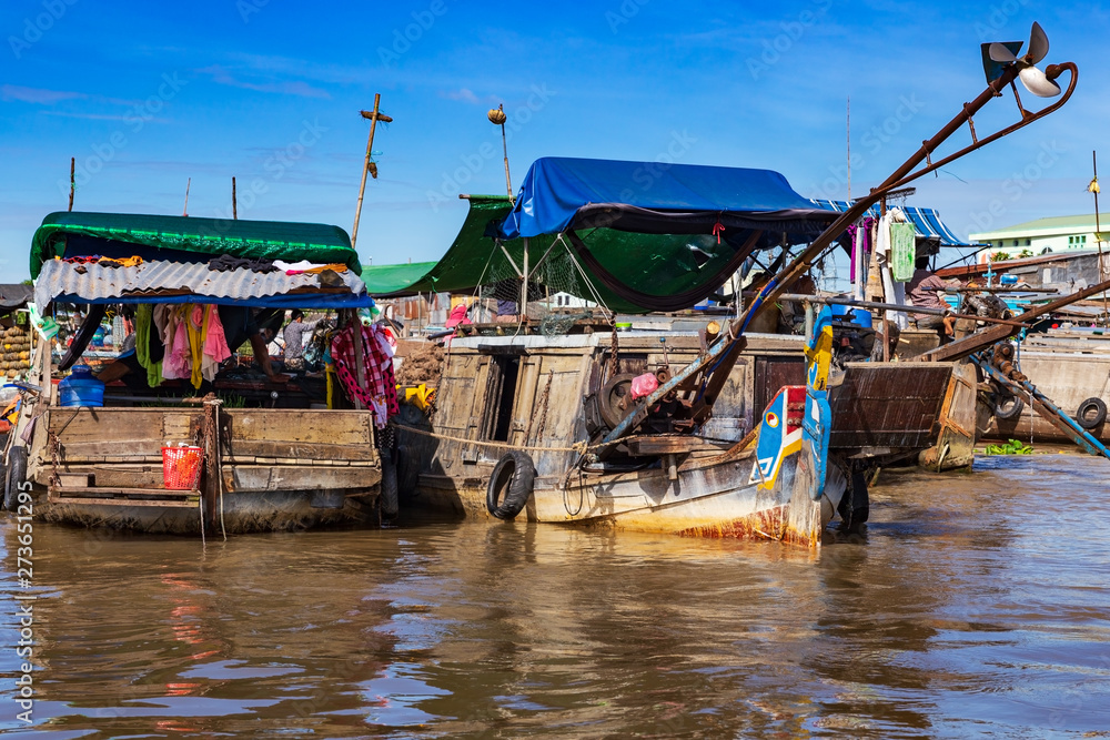 Long-tail boats, house boats and sampans moored side by side near Can Tho, Mekong Delta, Vietnam.