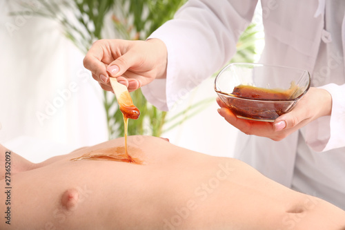 Young man during epilation ...