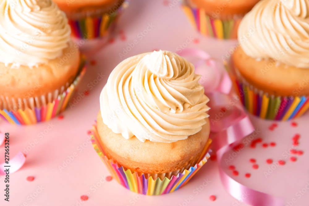 Tasty Birthday cupcakes on color background, closeup Tasty Birthday cupcakes on color background, closeup