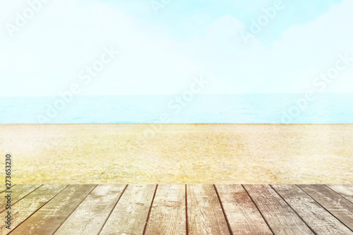 Table top with beach background, sky and cloud in sunny day for product display job showing. Wooden table for display or montage your products.