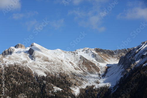 Snow-capped mountains in Trentino Alto Adige. Mountains in winter. Winter landscape in the Alps Mountains  Moena  Val di Fassa.